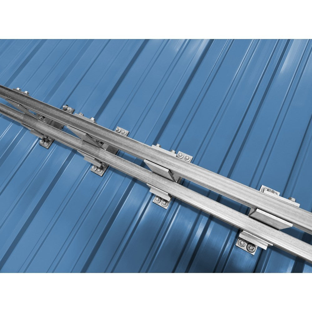 Close-up of double bar snow retention system hardware and mounting brackets on metal roof