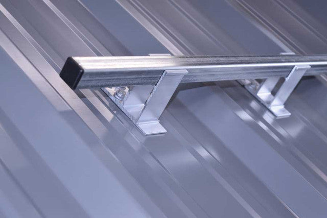 SnoBar screw-down snow rail bracket anchored into metal roof structure