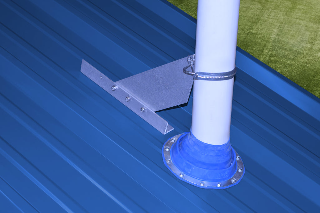 VentSaver EZ installed above a roof vent to deflect sliding snow on a metal roof.